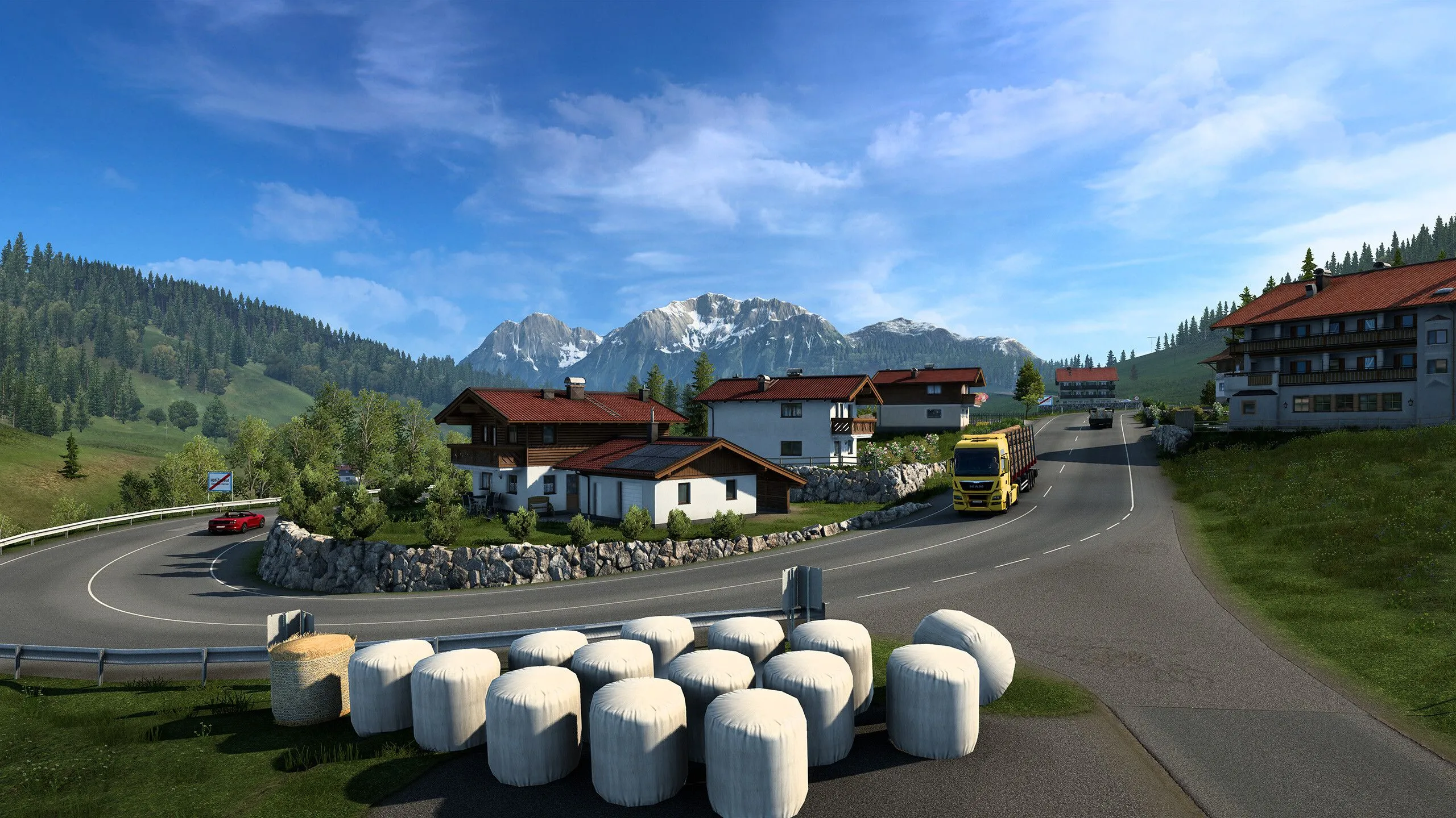 Hình ảnh từ game Euro Truck Simulator 2 cho thấy xe tải chạy trên đường cao tốc với khung cảnh nông thôn châu Âu.
