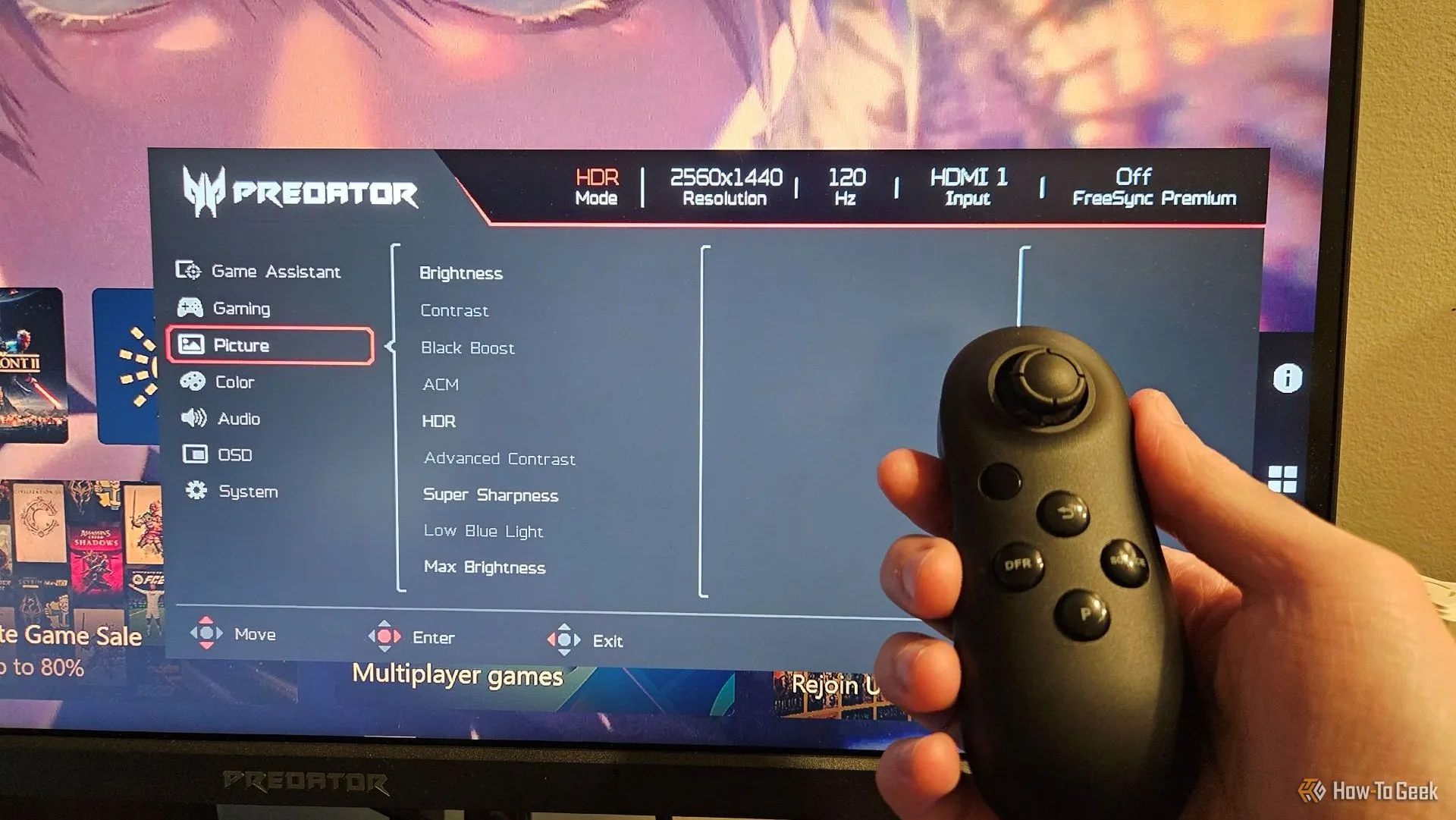 Điều khiển từ xa nhỏ gọn của Acer Predator XB273K V5 và giao diện menu OSD hiển thị trên màn hình, giúp điều chỉnh cài đặt dễ dàng