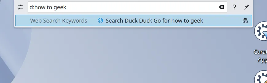 KRunner hiển thị kết quả tìm kiếm DuckDuckGo cho cụm từ &quot;how to geek&quot;, cho thấy tính năng tìm kiếm web tích hợp