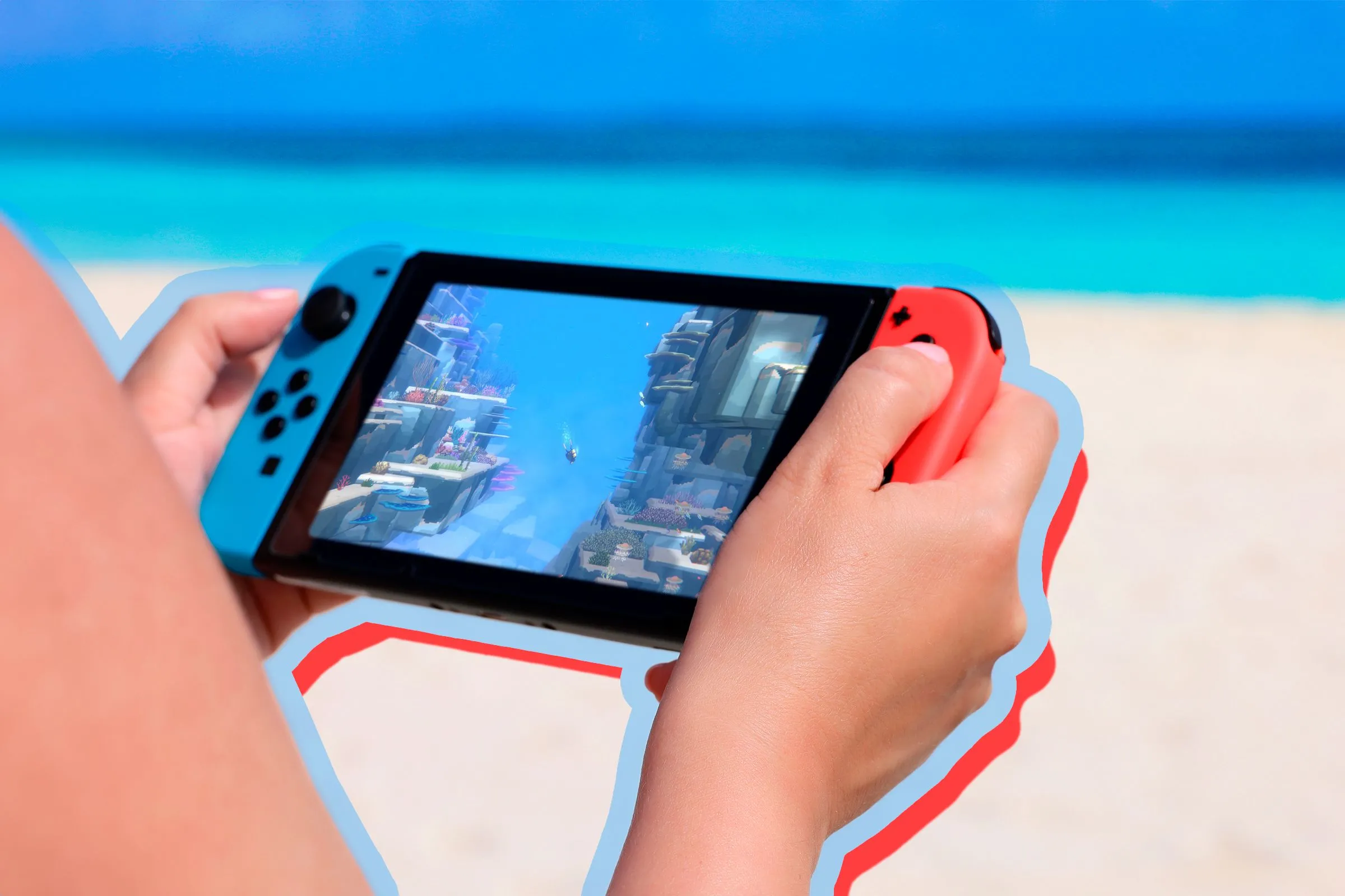 Người chơi Nintendo Switch trên bãi biển