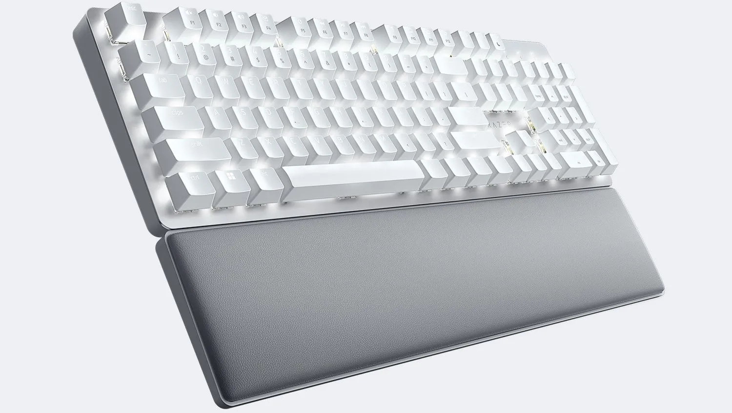 Bàn phím cơ không dây Razer Pro Type Ultra màu trắng với thiết kế hiện đại, đi kèm kê tay giả da sang trọng.